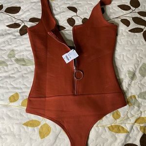 Brand new bodysuit. Tag still on, got the wrong size.